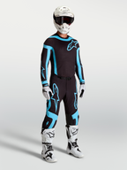 Alpinestars maglia Supertech Vesta e Supertech Vesta Gear Set, completo da motocross nero e turchese, vestibilità racing.