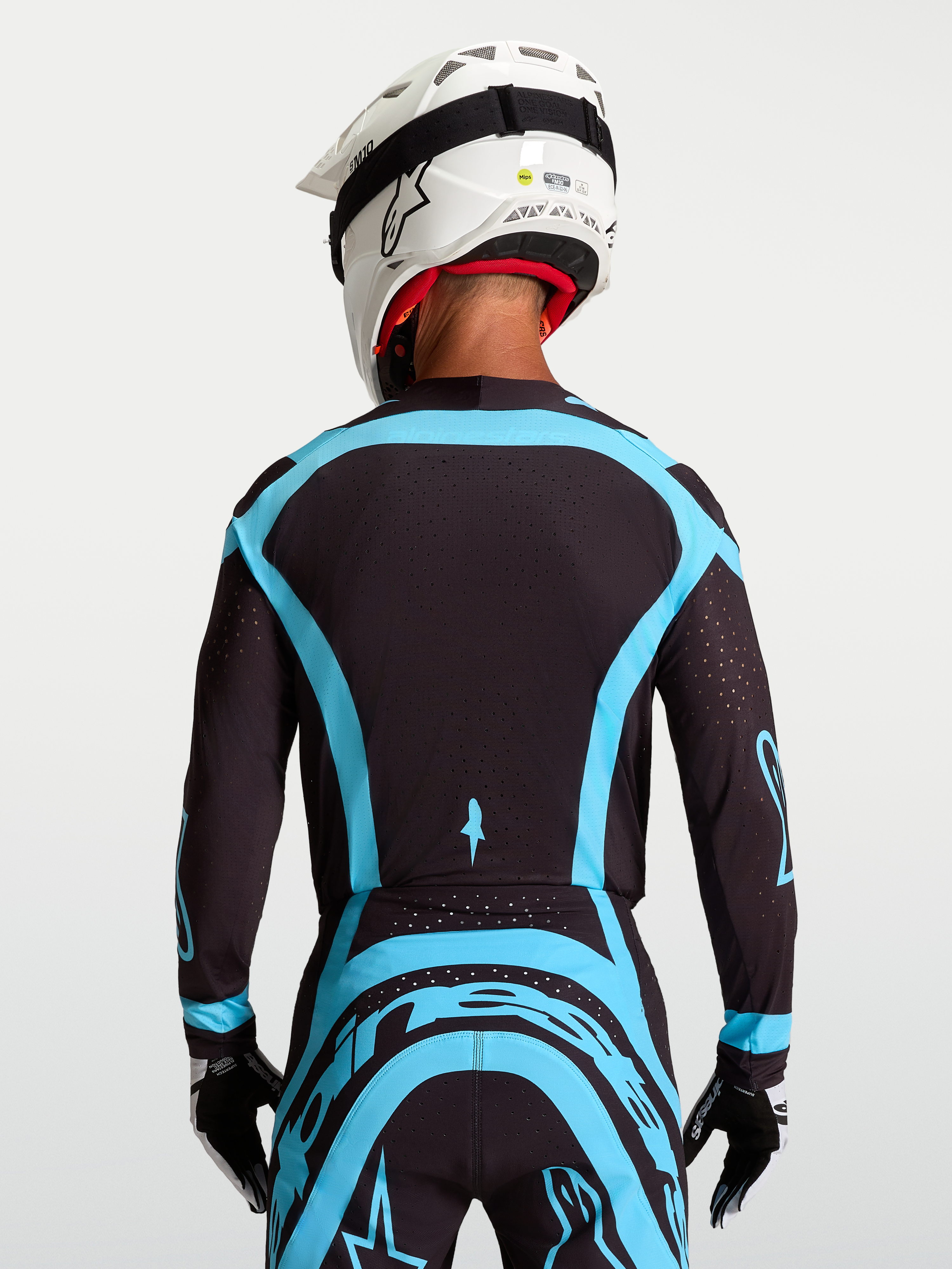 Alpinestars maglia Supertech Vesta, maglia da motocross pro-level per uomo, nero e turchese, in mesh elasticizzato con perforazioni laser, vista posteriore