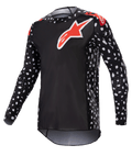 Alpinestars 2023 Supertech North Jersey, maglia da motocross, nero e rosso neon, maniche lunghe con motivo a puntini bianchi, loghi a stella rossi e bianchi su petto e spalle, rete tecnica leggera con vestibilità atletica da gara