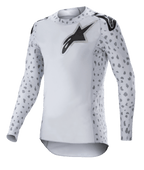 Alpinestars 2023 Supertech North Jersey, maglia da motocross, grigio haze e nero, maglia bianca a maniche lunghe con motivo maculato grigio su maniche e fianchi, logo stella nero su petto e spalle, tessuto in rete elastica con bordo curvo