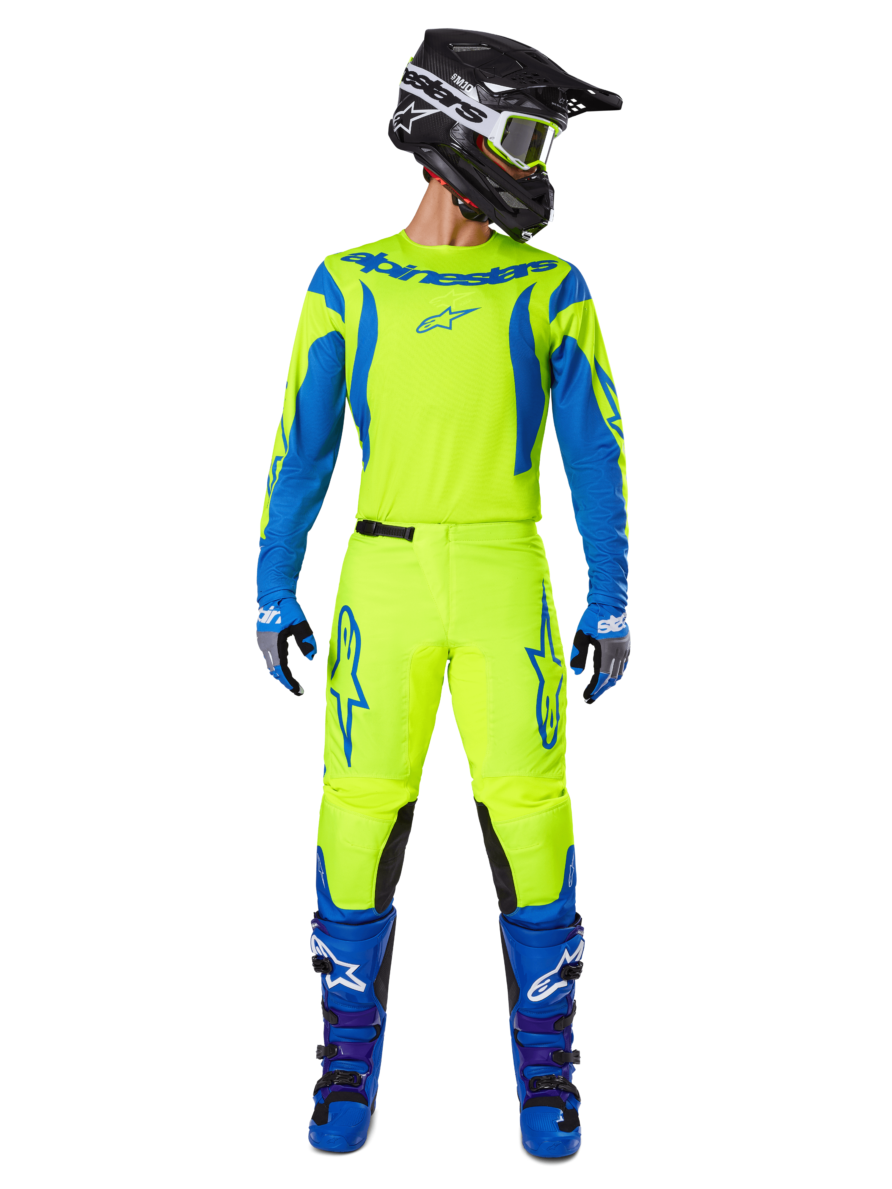 Set completo Alpinestars Fluid Haul 2025, maglia e pantaloni da motocross, giallo fluo e blu, indossati con stivali blu coordinati e un casco nero, caratterizzato da vistosi loghi Astars e un taglio ergonomico atletico per gare off-road.