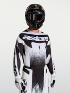 Alpinestars maglia Techstar Swan, maglia da motocross da uomo, nera e bianca, vestibilità atletica con ventilazione laser, indossata per gare fuoristrada