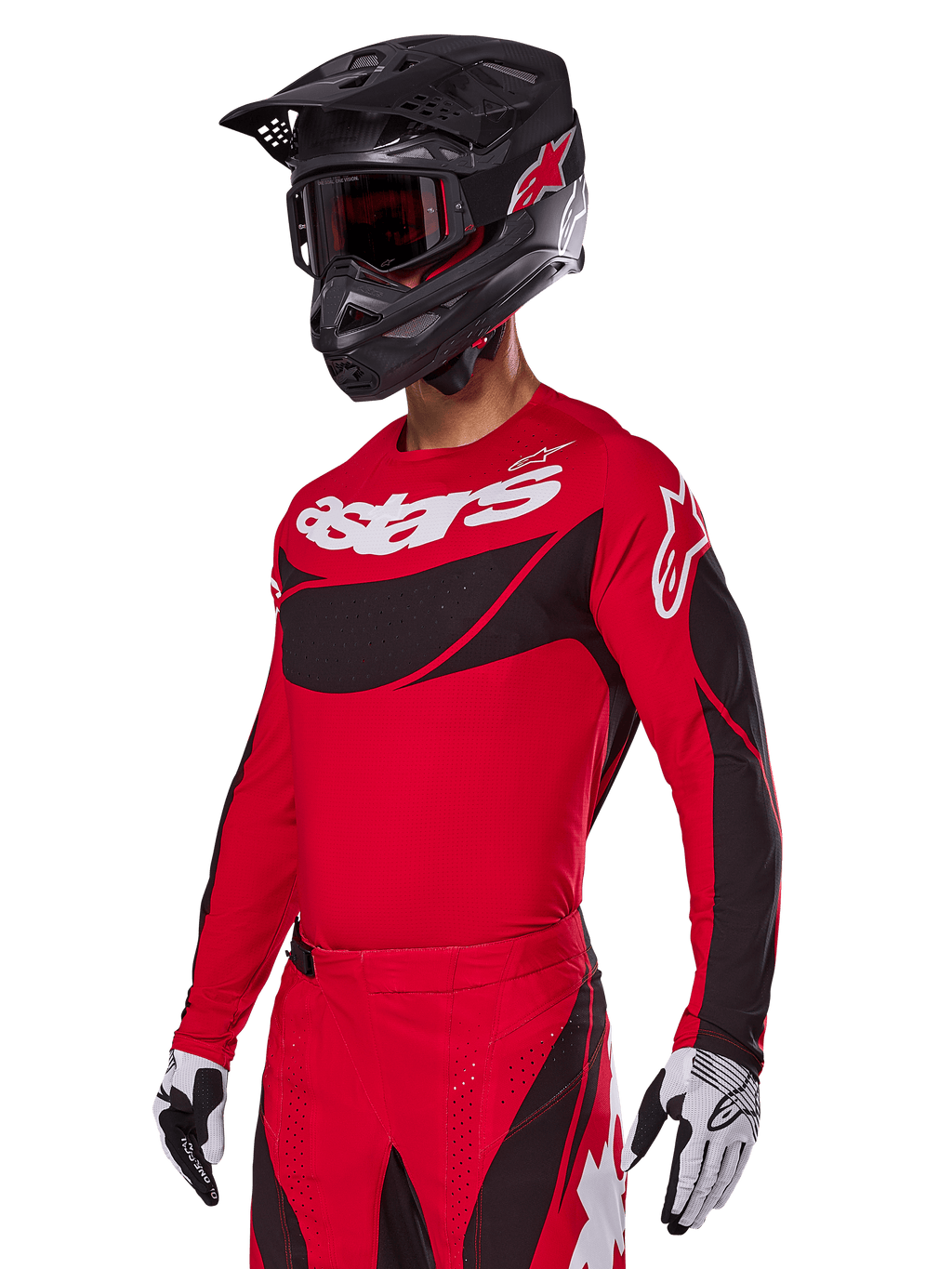 Set completo Alpinestars Techstar Dreem 2025, maglia e pantaloni da motocross rossi con accenti neri e bianchi, indossati con casco e occhiali neri, guanti bianchi e neri, con logo 'astars' in evidenza, progettato per gare off-road ad alte prestazioni