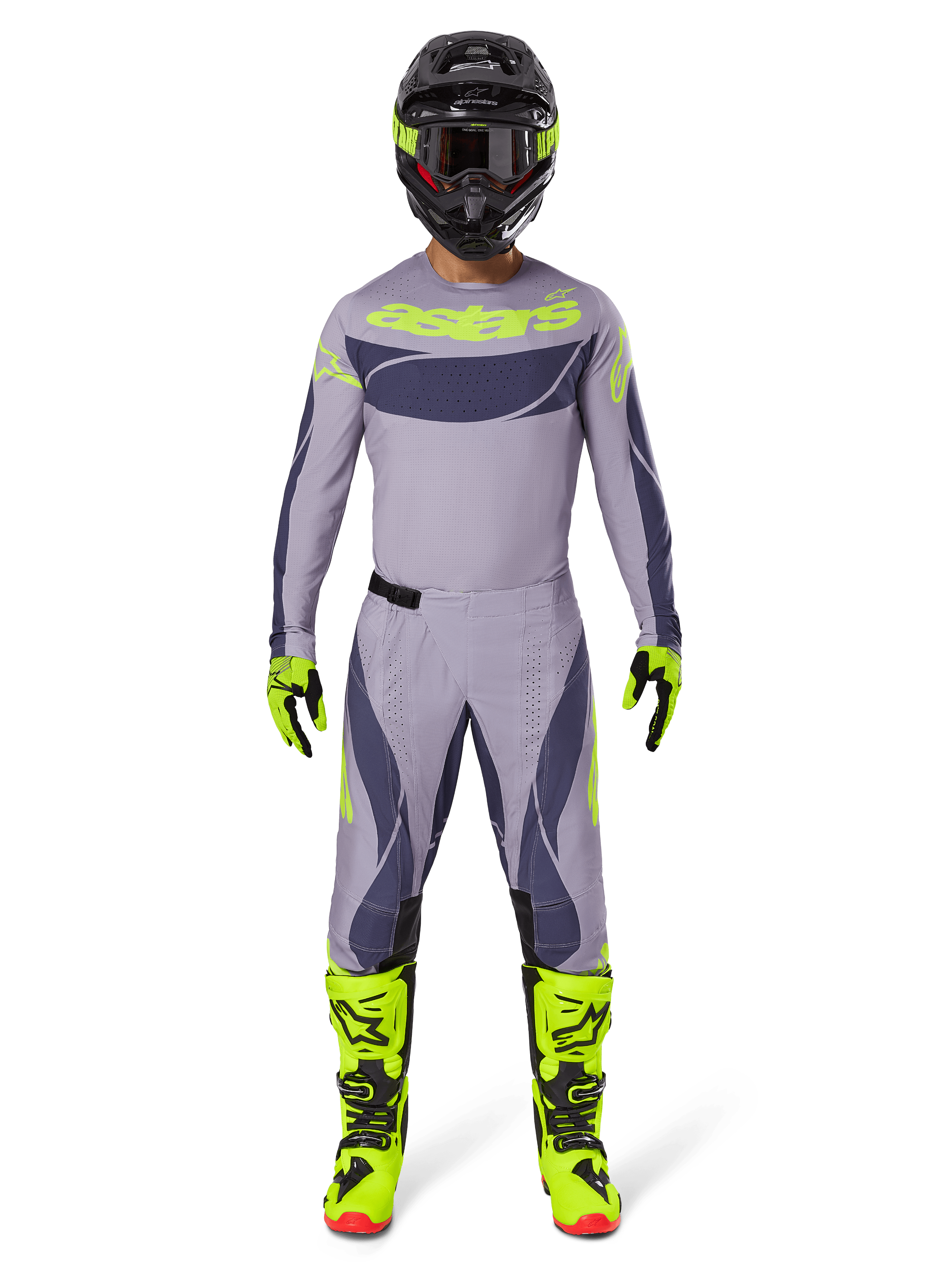 Pilota di motocross con abbigliamento completo da gara Alpinestars, Maglia Techstar Dreem 2025 in grigio e grigio scuro con loghi giallo neon, pantaloni coordinati grigio e grigio scuro, stivali giallo neon e neri, casco nero con accenti neon, completo professionale per motocross