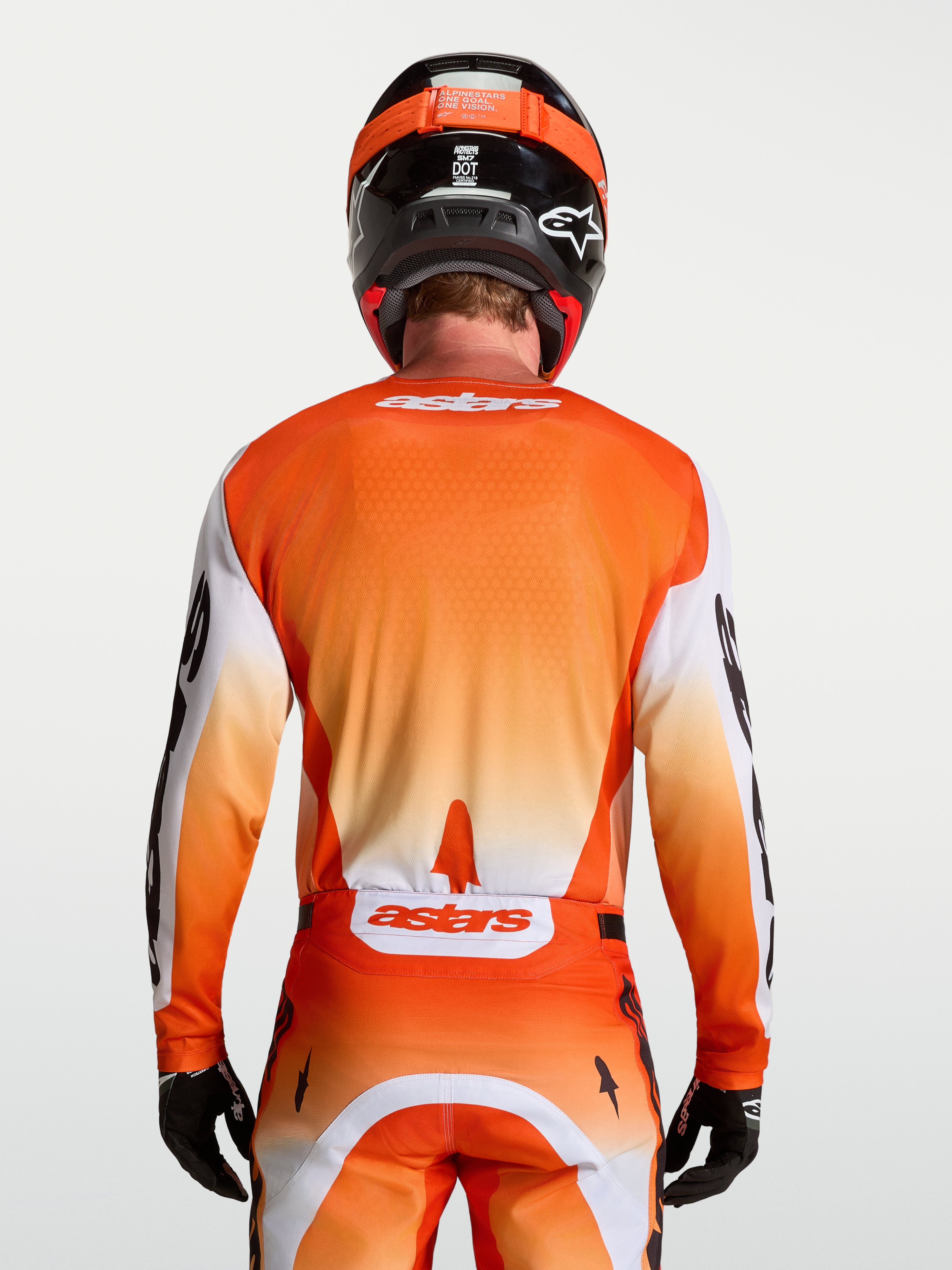 Alpinestars Maglia Racer Amber, maglia motocross da uomo, vista posteriore, arancione e bianca, tessuto tecnico traspirante.