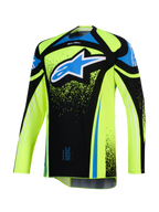 Alpinestars Maglia Techstar Nomur 2026, maglia da motocross, giallo fluo e nero con accenti blu, grande logo Astar blu e bianco sul petto, dettagli grafici effetto splatter, maniche lunghe, abbigliamento tecnico da competizione off-road