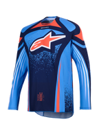 Alpinestars Maglia Techstar Nomur 2026, maglia da motocross, blu scuro e azzurro UCLA con accenti arancioni, grande logo Astars bianco sul petto e strisce diagonali sulle maniche lunghe, vestibilità atletica per prestazioni off-road