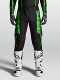 Alpinestars Pantaloni Fluid Apex V2 2027, pantaloni motocross uomo neri e verdi, ginocchia rinforzate e stivali bianchi