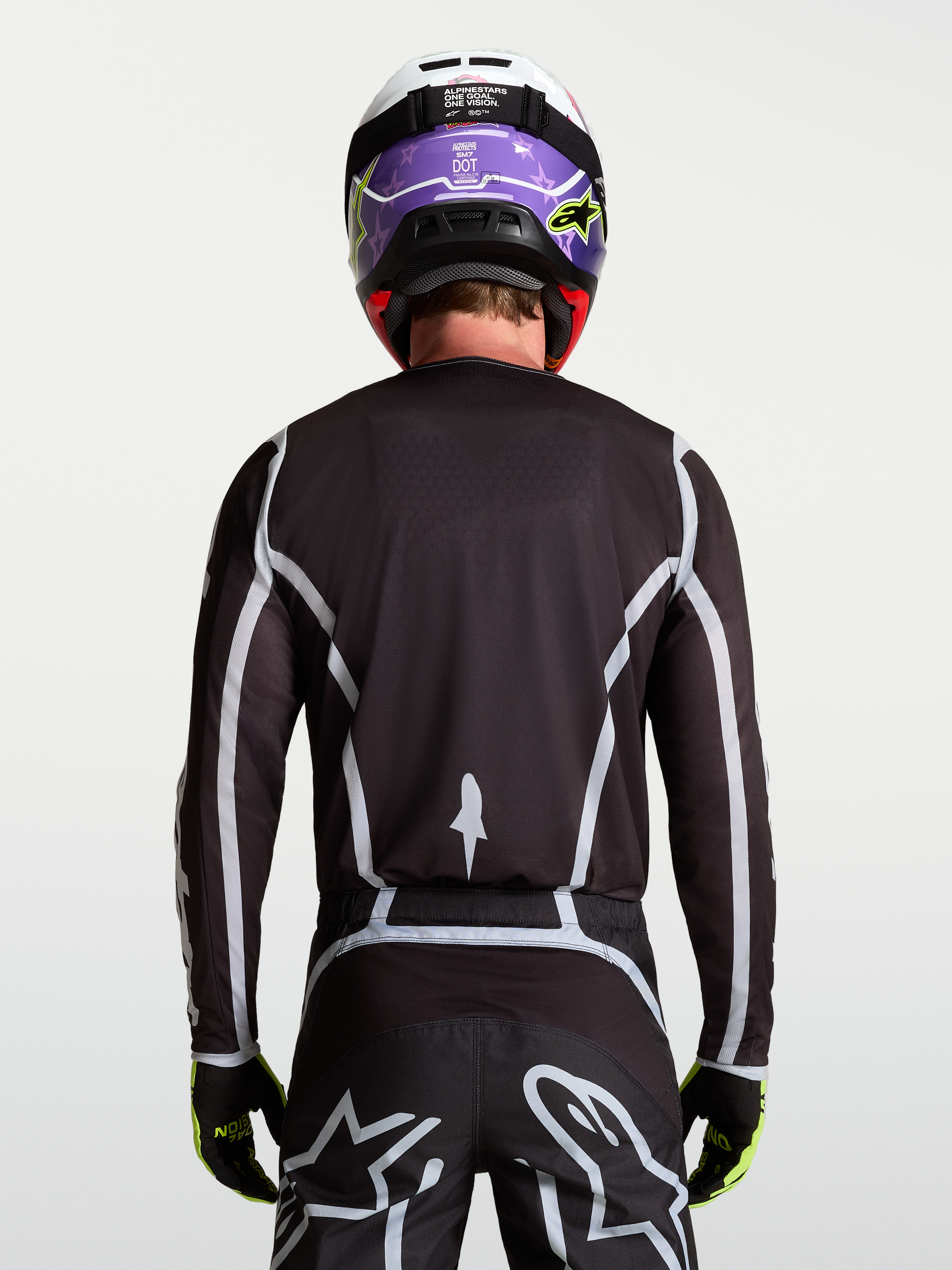 Alpinestars Maglia Fluid Apex V2, maglia motocross da uomo, nera e argento, vista posteriore con fit atletico ergonomico.