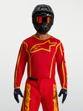 Alpinestars Maglia Fluid Apex V2, maglia motocross da uomo, rosso fuoco e oro, tessuto leggero anti-umidità.