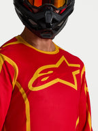 Alpinestars Maglia Fluid Apex V2, maglia da motocross per uomo, rossa e oro, con grande logo a stella sul petto.