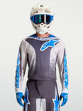 Alpinestars maglia Fluid Drag, maglia da motocross da uomo, grigia e blu, tessuto traspirante, indossata da un pilota