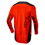 Maglia Alpinestars 2024 Fluid Lurv, maglia da motocross, arancione acceso e nero, vista posteriore con grande logo a stella nero e marchio Alpinestars sulle maniche, design con parte posteriore allungata per una maggiore copertura, leggero poli-tessuto per corse fuoristrada
