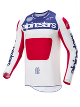 Alpinestars Maglia Techstar Fortitude Limited Edition, maglia da motocross, rosso, bianco e blu, caratterizzata da un corpo bianco con un grande pannello centrale rosso, sezione del petto blu con marchio Alpinestars bianco e loghi blu sulle maniche, progettata per prestazioni elevate nel fuoristrada.