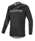 Maglia Alpinestars Fluid Graphite, maglia da motocross, nero e grigio scuro, con logo ASTARS grigio sul petto e sulla spalla, logo a stella sulla manica, costruzione in mesh tecnico a maniche lunghe per il fuoristrada