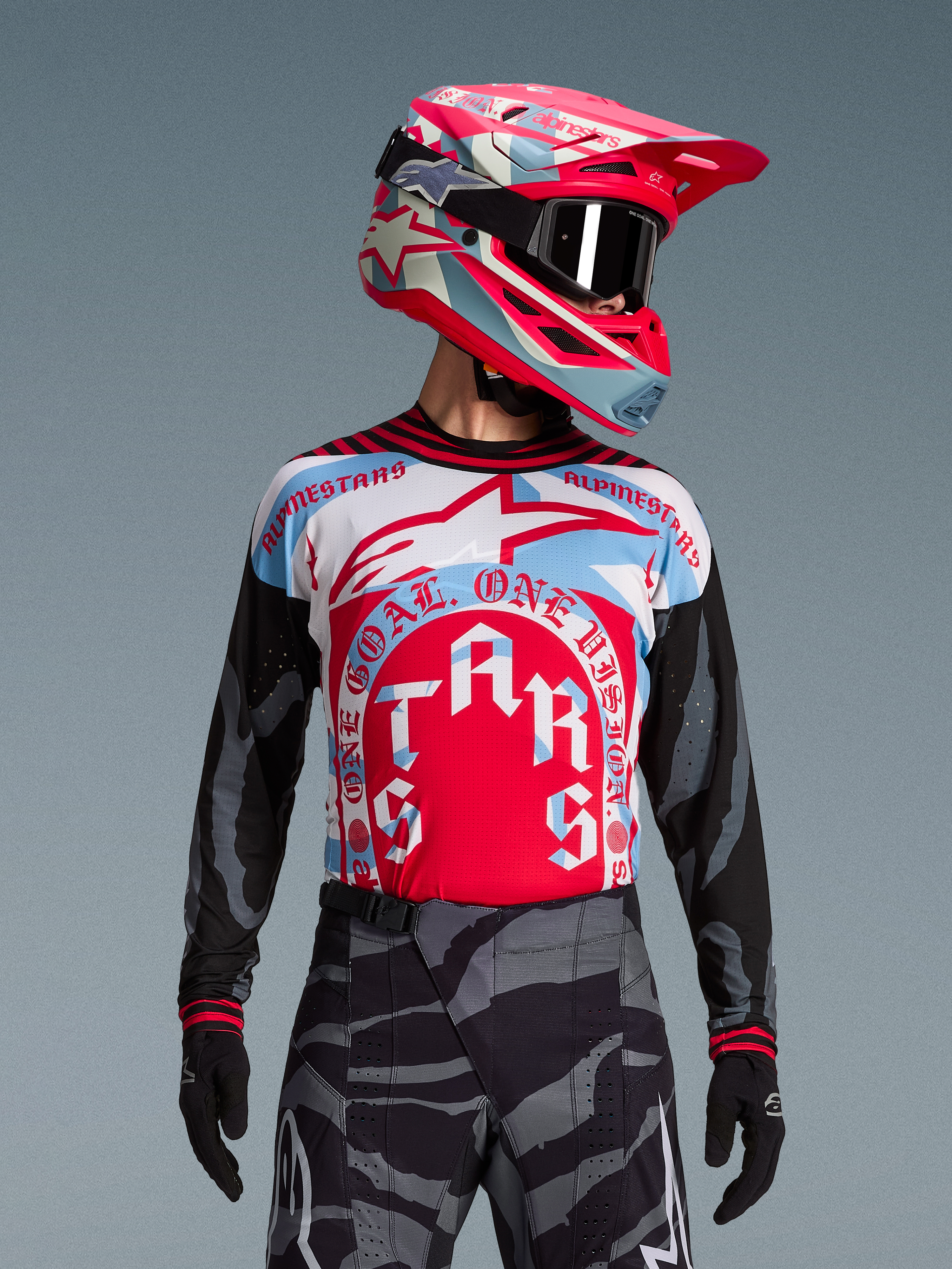 Maglia Techstar Beast Coast Alpinestars, grafica bianco e rosso con maniche camo, abbigliamento tecnico da motocross.