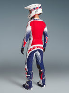 Alpinestars Techstar Unity Limited Edition maglia e pantaloni, completo da motocross da uomo, rosso, bianco e blu, vista posteriore.