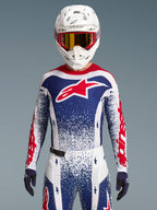 Alpinestars Completo Techstar Unity edizione limitata, completo da motocross rosso, bianco e blu con vestibilità atletica.