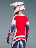 Alpinestars Techstar Unity Maglia in edizione limitata, maglia da motocross uomo rossa e blu con schiena ventilata.