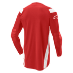 Alpinestars Techdura Jersey, maglia da motocross ed enduro, rosso vivace con pannelli bianchi, vista posteriore con retro allungato e gomiti rinforzati, logo Alpinestars bianco sulla manica, equipaggiamento resistente per performance fuoristrada