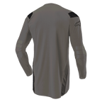 Alpinestars Techdura Jersey, maglia da motocross Falcon Brown, vista posteriore con retro allungato per maggiore copertura, maniche lunghe con gomiti rinforzati, pannelli neri sulle spalle e logo sulla manica, abbigliamento resistente per fuoristrada