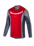 Alpinestars Youth Racer Melt Jersey 2025, maglia da motocross, rosso acceso e grigio, con grande logo bianco sul petto e dettagli giallo neon sulle spalle, tessuto tecnico a maniche lunghe per guida fuoristrada