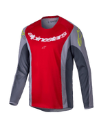Alpinestars Youth Racer Melt Jersey 2025, maglia da motocross, rosso acceso e grigio, con grande logo bianco sul petto e dettagli giallo neon sulle spalle, tessuto tecnico a maniche lunghe per guida fuoristrada