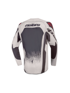 Alpinestars maglia Supertech Swan ragazzo 2027, maglia da motocross per giovani piloti, grigio e grigio scuro con accenti rossi, vista posteriore, mesh tecnico ventilato.