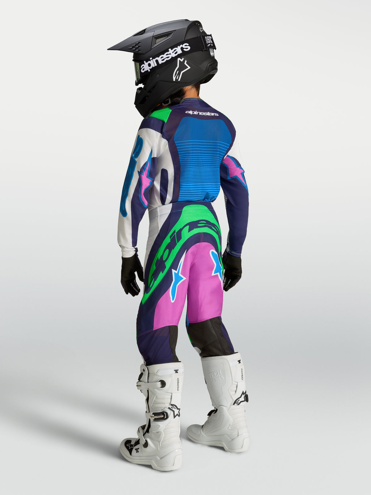 Alpinestars completo Supertech Maven Ragazzo 2027, maglia motocross blu e verde fluo, vista posteriore, fit racing atletico.