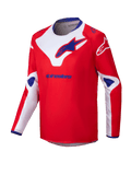 Alpinestars 2025 Youth Racer Veil Jersey, maglia da motocross, rosso con accenti bianchi e blu, tessuto traspirante a maniche lunghe, grandi loghi Alpinestars sul petto e sulle spalle, colletto interno blu, abbigliamento tecnico per fuoristrada