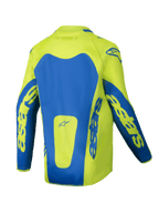 Alpinestars Maglia Youth Racer Veil 2025, maglia da motocross, giallo fluo e blu, vista posteriore con ampi pannelli blu e branding Astars sulle maniche, taglio posteriore allungato per maggiore copertura, tessuto leggero traspirante per corse fuoristrada