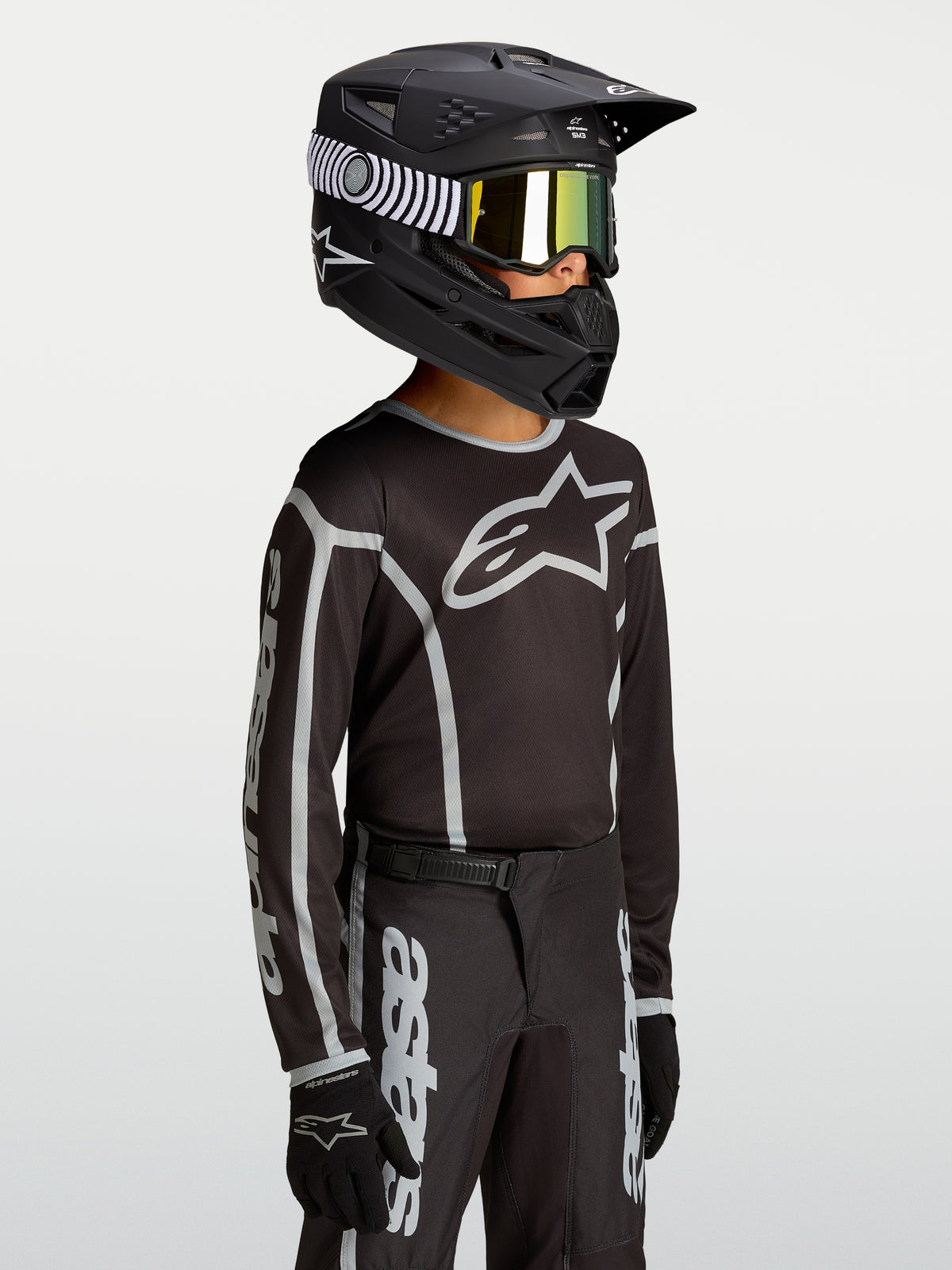 Alpinestars Maglia Fluid Apex V2 Ragazzo, maglia da motocross per ragazzi, nera e argento, logo a stella sul petto, tessuto traspirante per fuoristrada