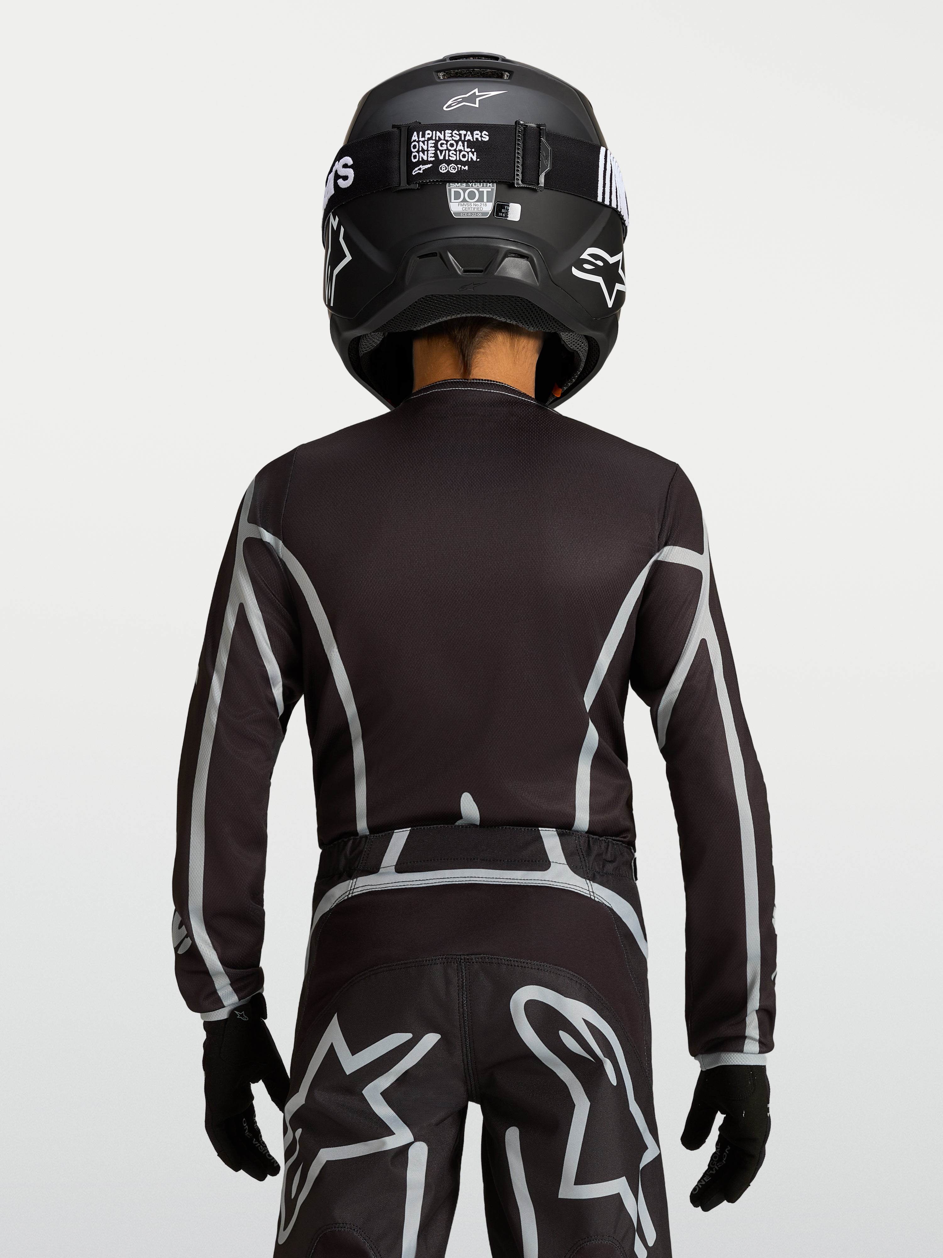 Alpinestars Maglia Fluid Apex V2 Ragazzo, maglia motocross nera e argento, vista posteriore con fit ergonomico off-road