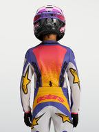 Alpinestars Maglia Fluid Drag Ragazzo 2027, maglia da motocross blu e gialla, vista posteriore con grafiche racing vivaci.
