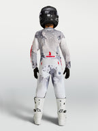 Alpinestars Maglia Fluid Lone Ragazzo 2027 e Ragazzo Fluid Lone Gear Set, completo motocross grigio camouflage e bianco con accenti rossi, vista posteriore