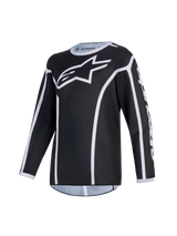 Alpinestars Maglia Fluid Apex Ragazzo 2026, maglia da motocross, nero e grigio, con un grande logo A-star bianco sul petto, bordature bianche e colletto sportivo, abbigliamento tecnico a maniche lunghe per guida off-road per ragazzi