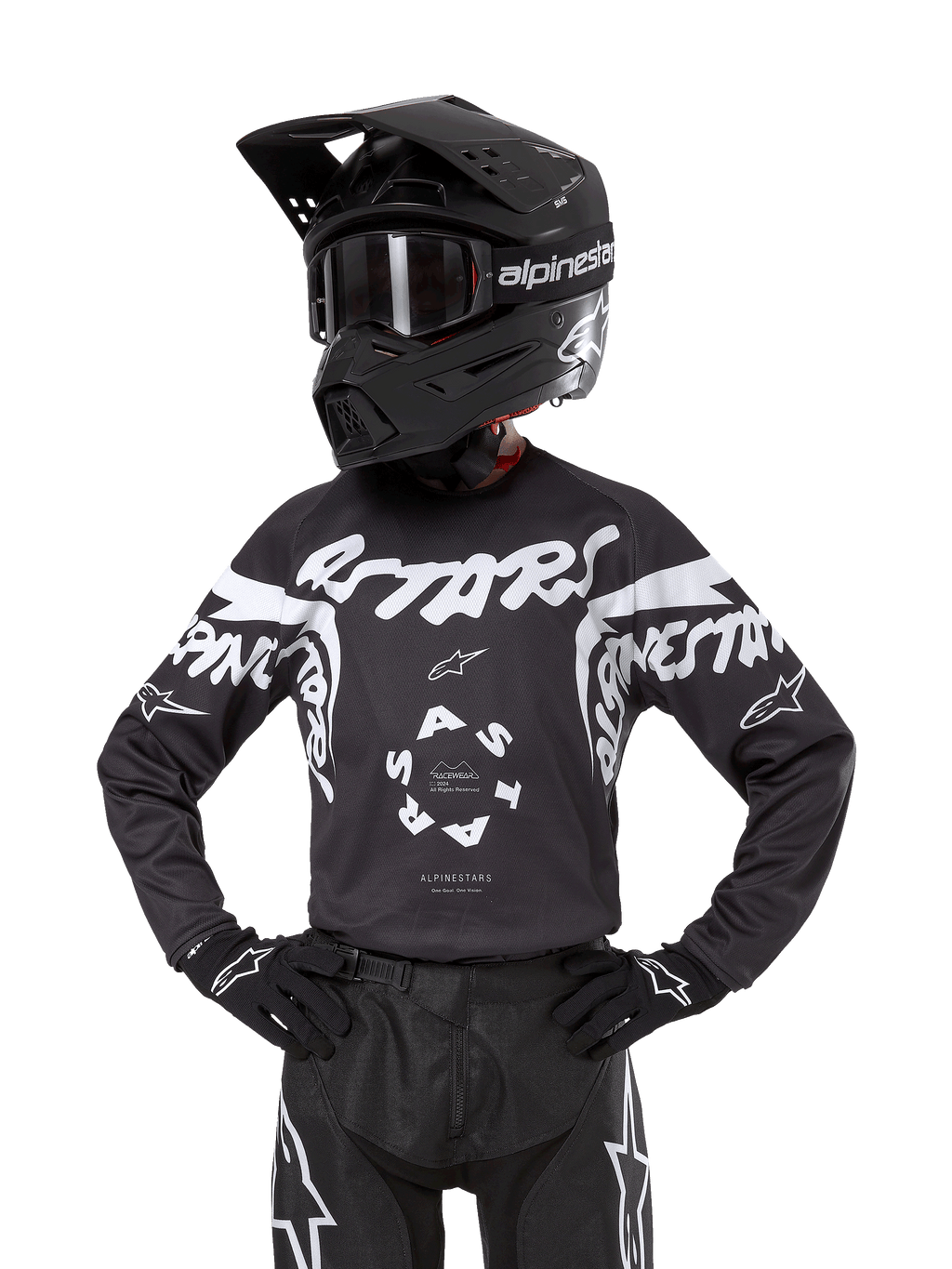 Alpinestars Youth 2024 Racer Hana Jersey, maglia da motocross per ragazzi, nero e bianco con grandi loghi bianchi, a maniche lunghe, indossata con casco e guanti da motocross neri