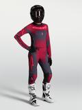 Alpinestars Stella Techstar Swan Maglia e Gear Set, completo motocross da donna, rosso e grigio scuro, con stivali bianchi.