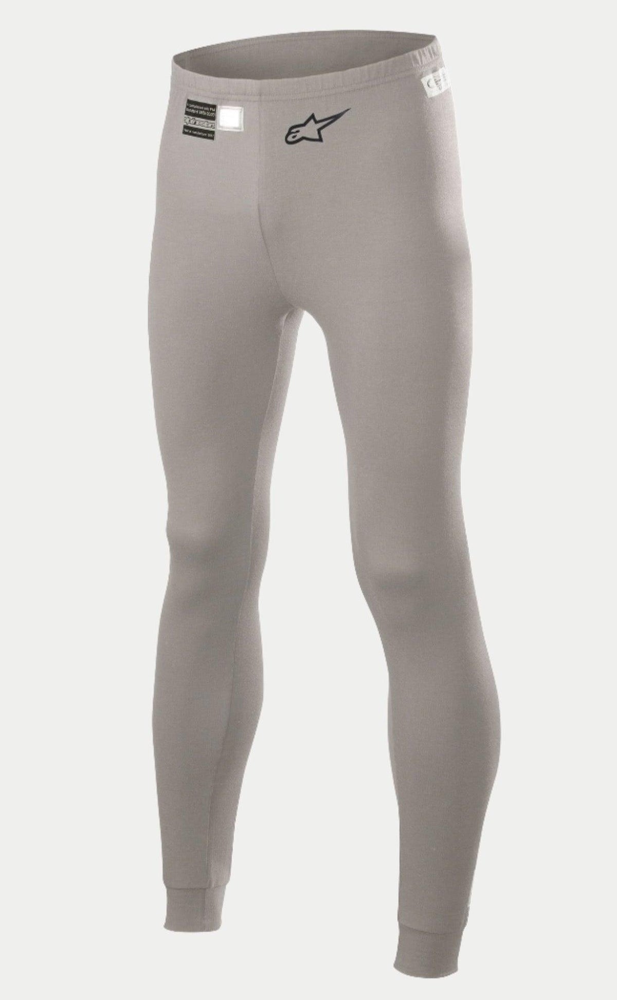 Alpinestars Race V2 Bottom FIA, pantaloni intimo tecnico per auto racing, grigio medio, con logo a stella nero sulla gamba ed etichetta di omologazione FIA in vita, tessuto ignifugo leggero con polsini alle caviglie.