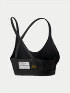 Alpinestars Stella TECH ZX Bra, reggiseno intimo tecnico per gare automobilistiche, nero, vista posteriore con etichetta di certificazione FIA 8856-2018, spalline sottili incrociate, materiale leggero resistente alle fiamme per protezione motorsport.
