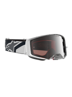 Alpinestars Maschere Supertech Hiten, maschere da motocross bianche e nere, lente argento a specchio, cinturino con logo a stella.