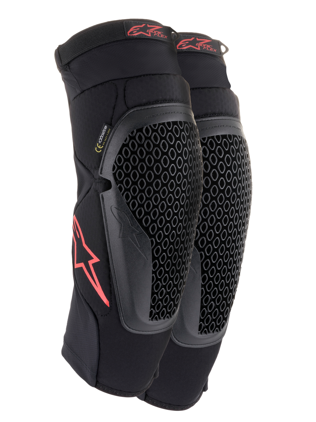 Ginocchiere Alpinestars Bionic Flex, nero e rosso, paio di ginocchiere da motocross con protezioni in tecnologia Nucleon Flex traforata, loghi Astars rossi e cinghie elasticizzate su una guaina in rete nera traspirante.
