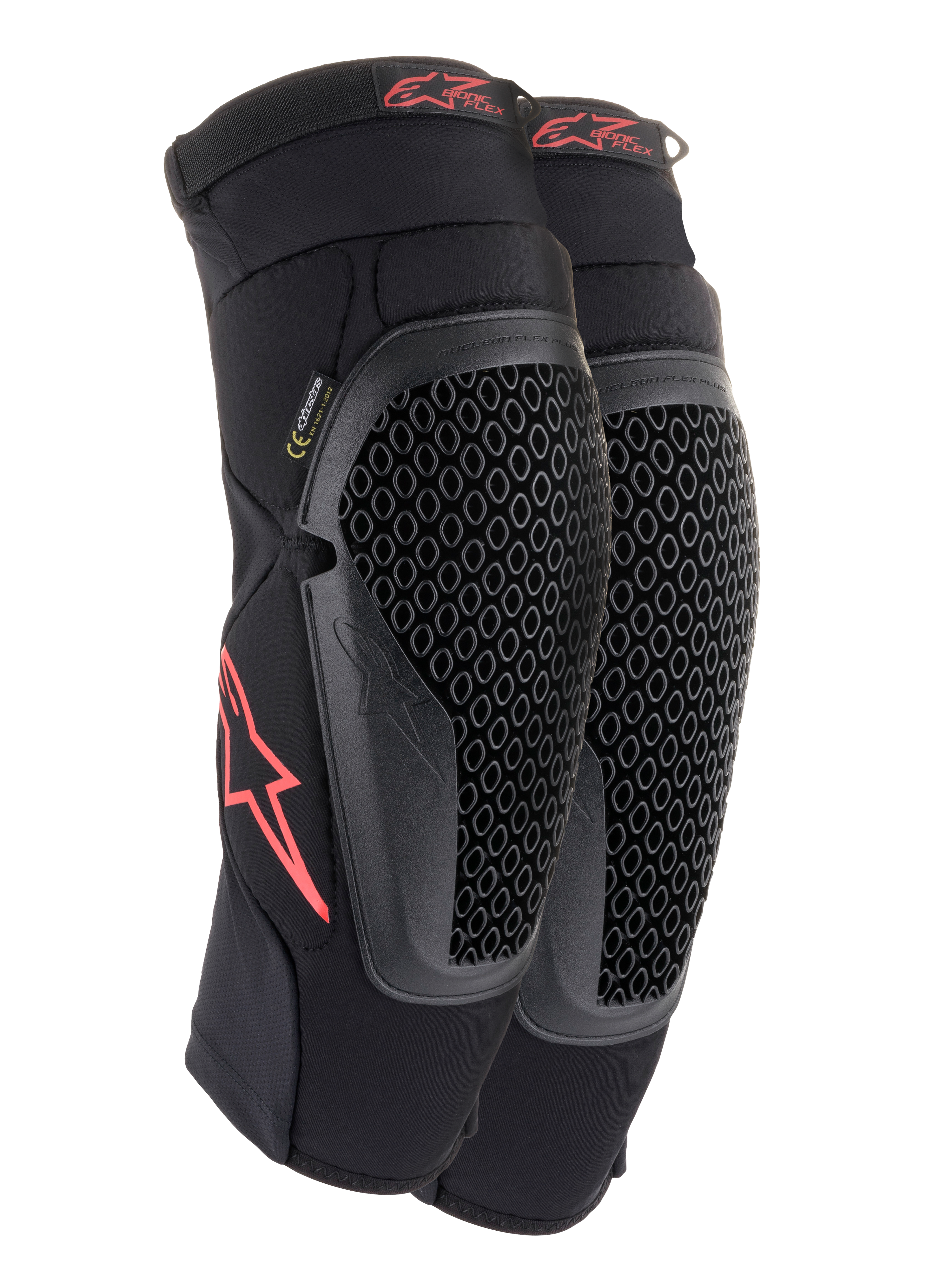 Ginocchiere Alpinestars Bionic Flex, nero e rosso, paio di ginocchiere da motocross con protezioni in tecnologia Nucleon Flex traforata, loghi Astars rossi e cinghie elasticizzate su una guaina in rete nera traspirante.
