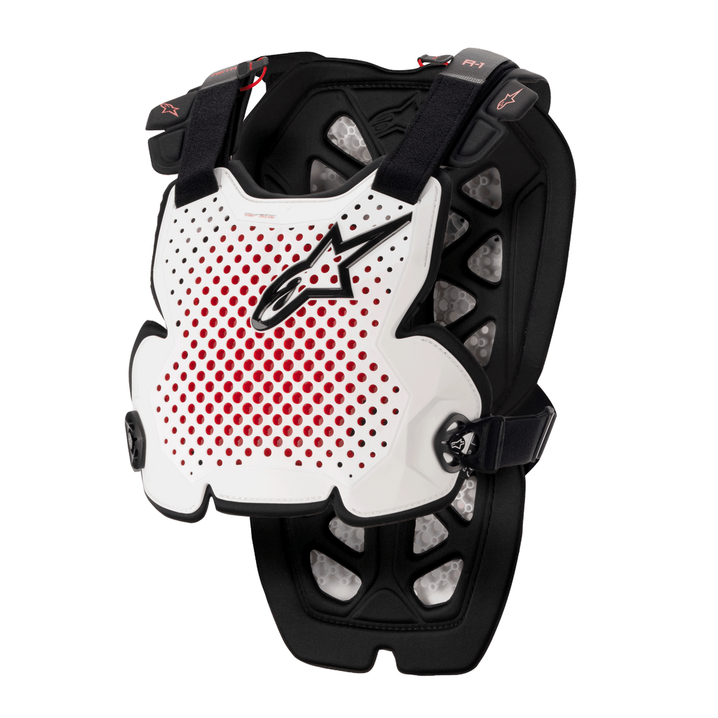 Alpinestars A-1 Pro Chest Protector, protezione per motocross, bianco, nero e rosso, con ventilazione traforata e interno rosso, logo a stella nero, cinghie nere regolabili, imbottitura protettiva leggera per gare fuoristrada