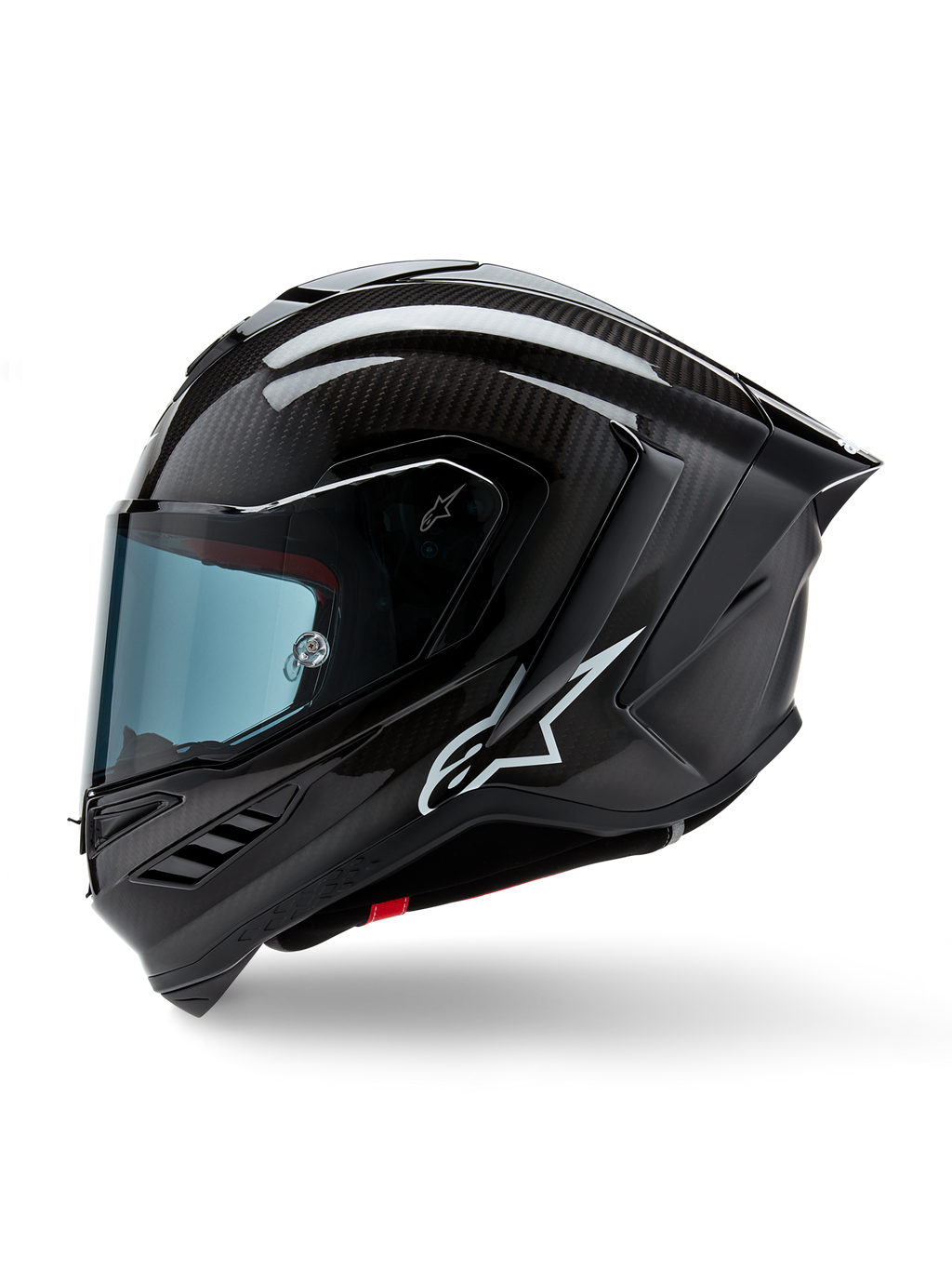 Casco Alpinestars Supertech R10 Solid, casco integrale racing da moto, carbonio nero opaco e lucido, trama in fibra di carbonio a vista, logo Alpinestars bianco sul lato, design aerodinamico con spoiler posteriore integrato e prese d'aria, vista laterale di profilo