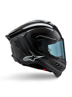 Casco Alpinestars Supertech R10 Solid, carbonio nero opaco e lucido, casco da moto racing, costruzione in fibra di carbonio, profilo laterale, visiera blu, design aerodinamico con alette, logo bianco, protezione ad alte prestazioni di livello MotoGP