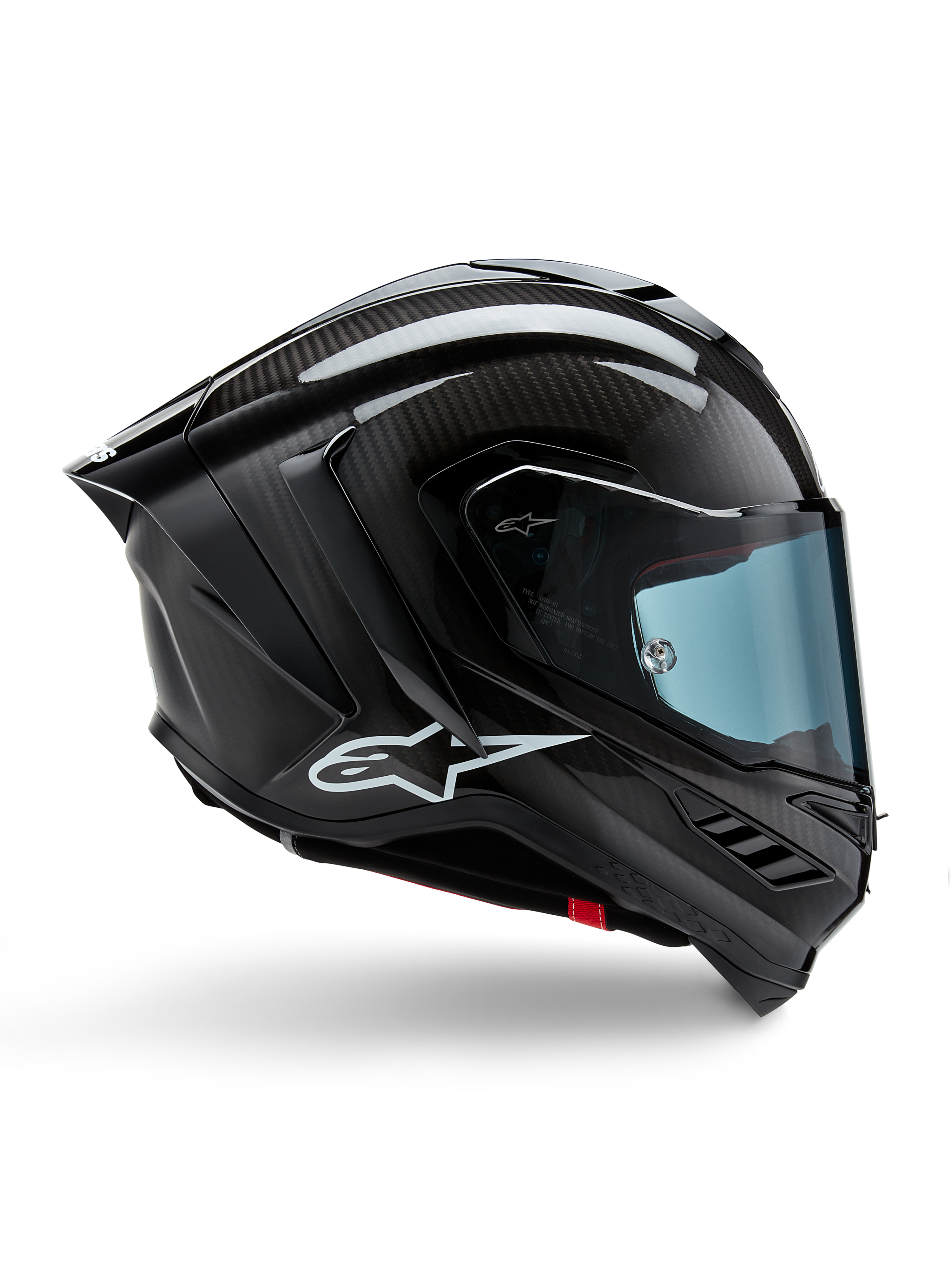 Casco Alpinestars Supertech R10 Solid, carbonio nero opaco e lucido, casco da moto racing, costruzione in fibra di carbonio, profilo laterale, visiera blu, design aerodinamico con alette, logo bianco, protezione ad alte prestazioni di livello MotoGP