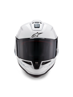 Casco Alpinestars Supertech R10 Solid, casco integrale da corsa, bianco lucido con dettagli neri, vista frontale con visiera scura fumé, sistema di ventilazione aerodinamico e logo Astars nero