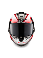 Casco Alpinestars Supertech R10 Team, vista frontale, nero carbonio rosso e bianco lucido, con visiera fumé scura, logo Astar bianco sulla fronte, branding Alpinestars rosso sulla mentoniera, design aerodinamico racing con grafiche elaborate