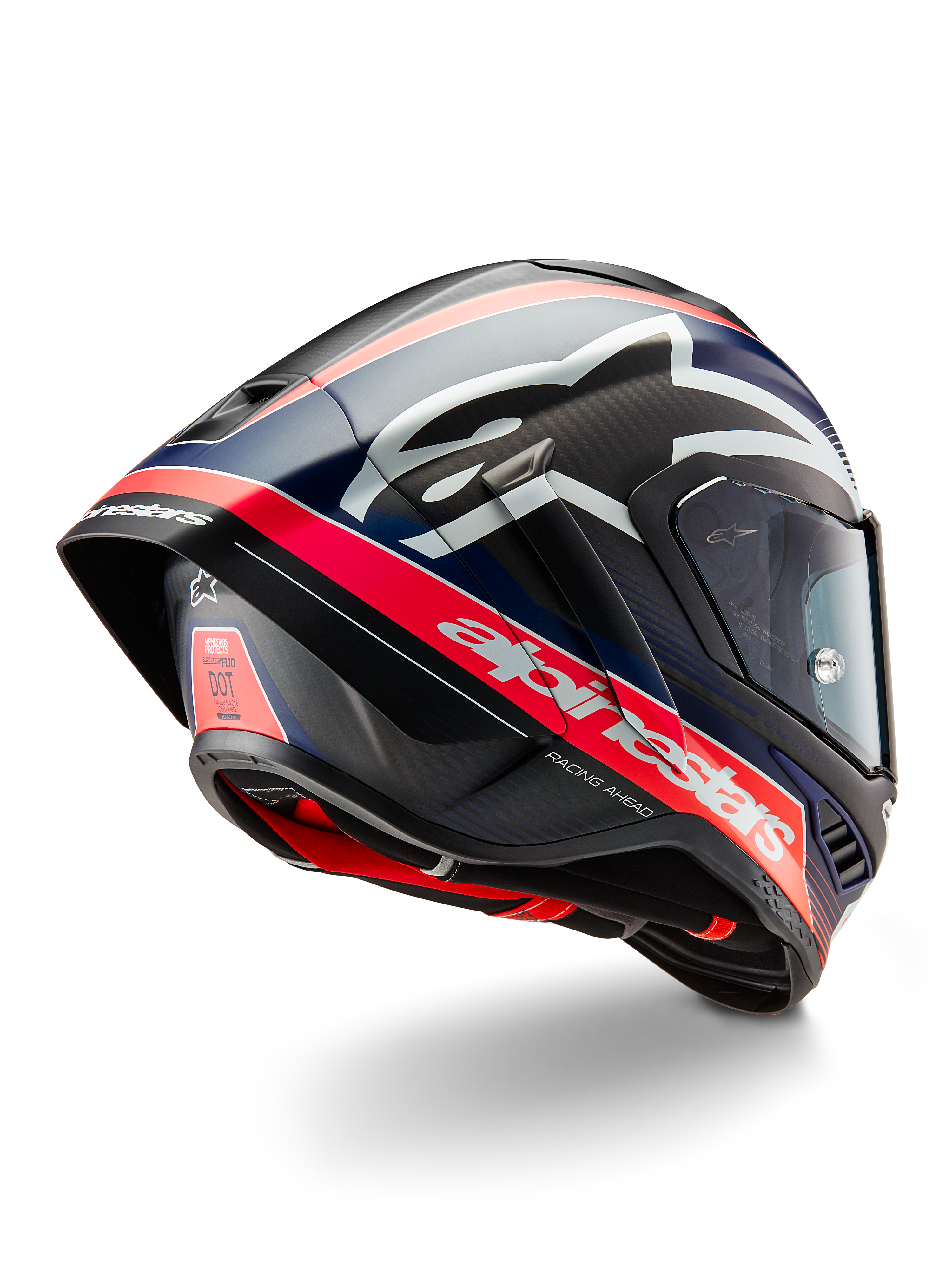 Casco Alpinestars Supertech R10 Team, casco professionale da competizione motociclistica, carbonio nero con dettagli rosso fluorescente e blu opaco, vista posteriore aerodinamica con spoiler integrato, branding Alpinestars in evidenza e trama della calotta in fibra di carbonio visibile.